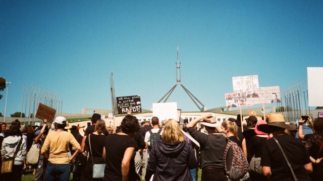 Picture of protest signs in front of Australian Parliament House at the March 4 Justice